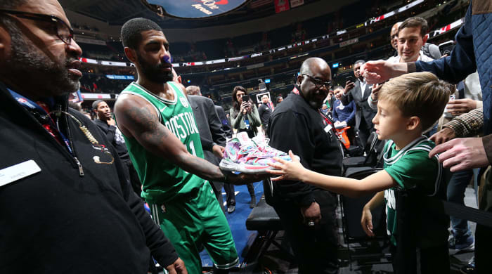 kyrie-irving-gives-sneakers-to-fan.jpg
